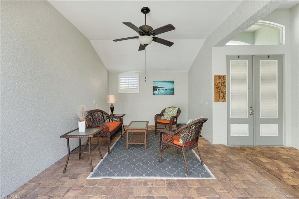 3232 Sundance Circle Naples, FL 34109 - Photo 27 of 50 a living room with furniture and a ceiling fan