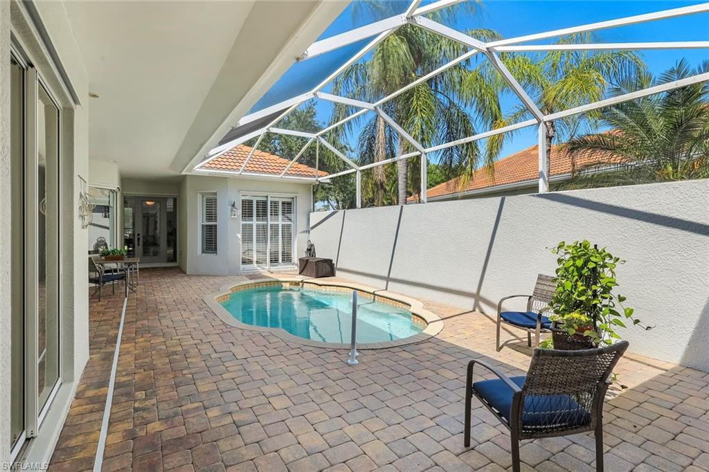 3232 Sundance Circle Naples, FL 34109 - Photo 30 of 50 a house with swimming pool