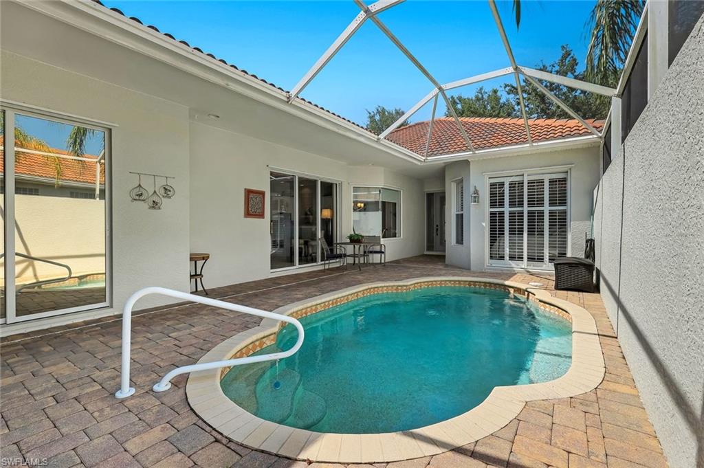 3232 Sundance Circle Naples, FL 34109 - Photo 33 of 50 a view of a house with swimming pool
