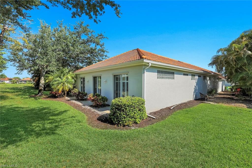 3232 Sundance Circle Naples, FL 34109 - Photo 35 of 50 a view of a house with backyard and garden