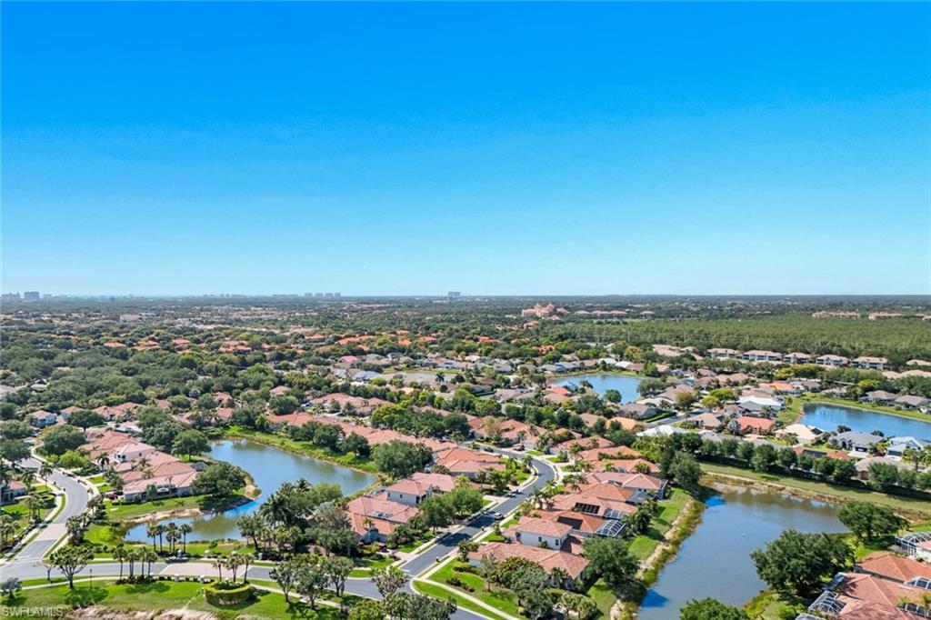 3232 Sundance Circle Naples, FL 34109 - Photo 41 of 50 an aerial view of a city with lots of residential buildings