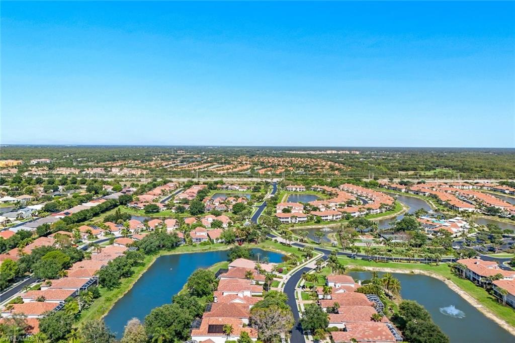 3232 Sundance Circle Naples, FL 34109 - Photo 42 of 50 an aerial view of residential building and lake