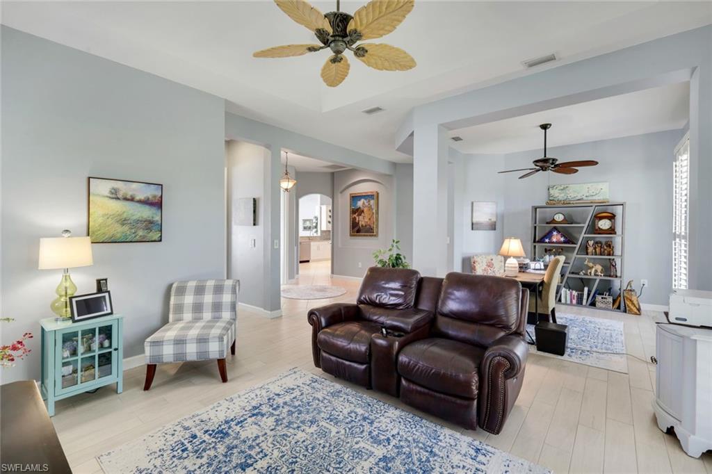 3232 Sundance Circle Naples, FL 34109 - Photo 6 of 50 a living room with furniture