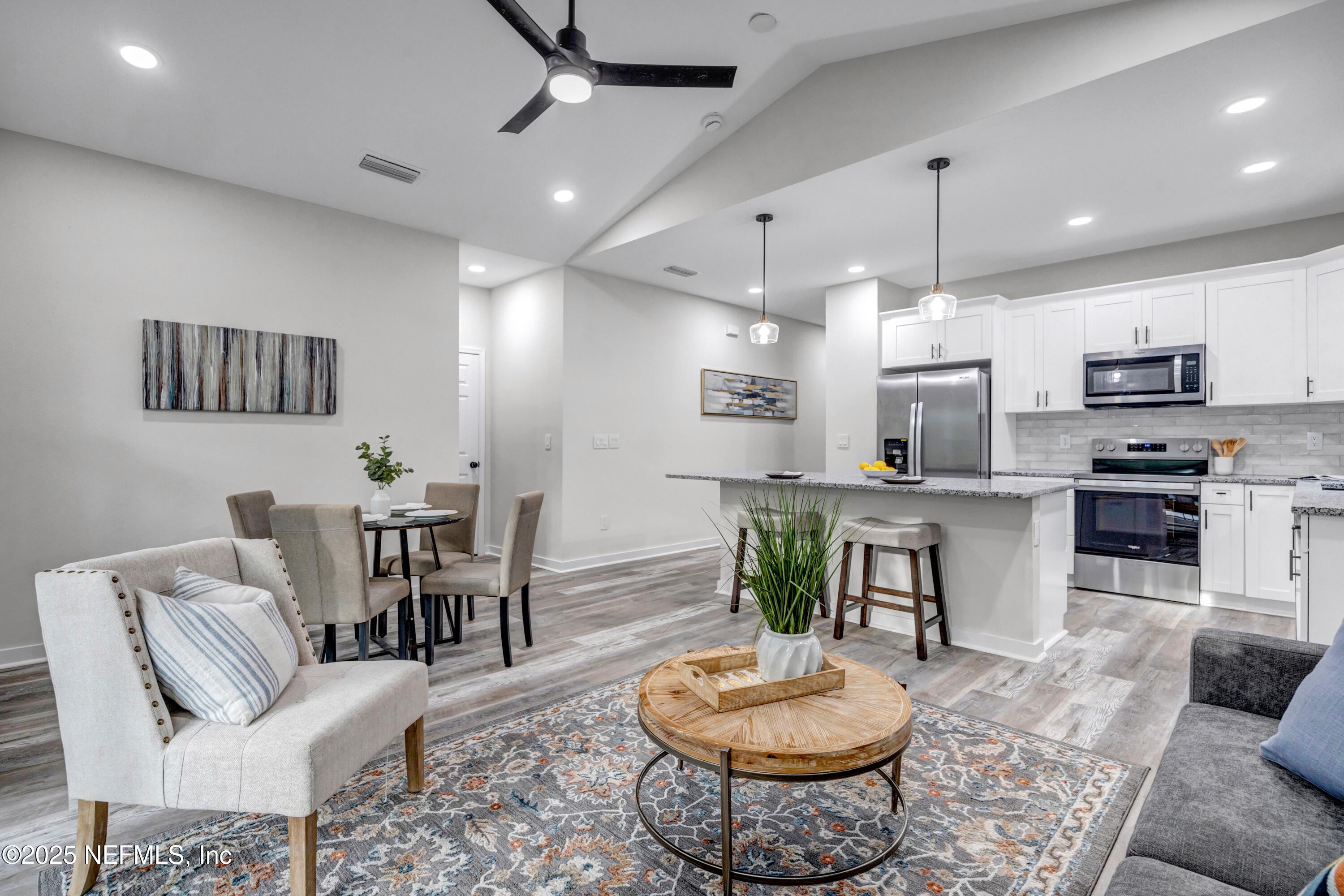 34 Delmonte Street Baldwin, FL 32234 - Photo 15 of 38 a living room with furniture and kitchen view