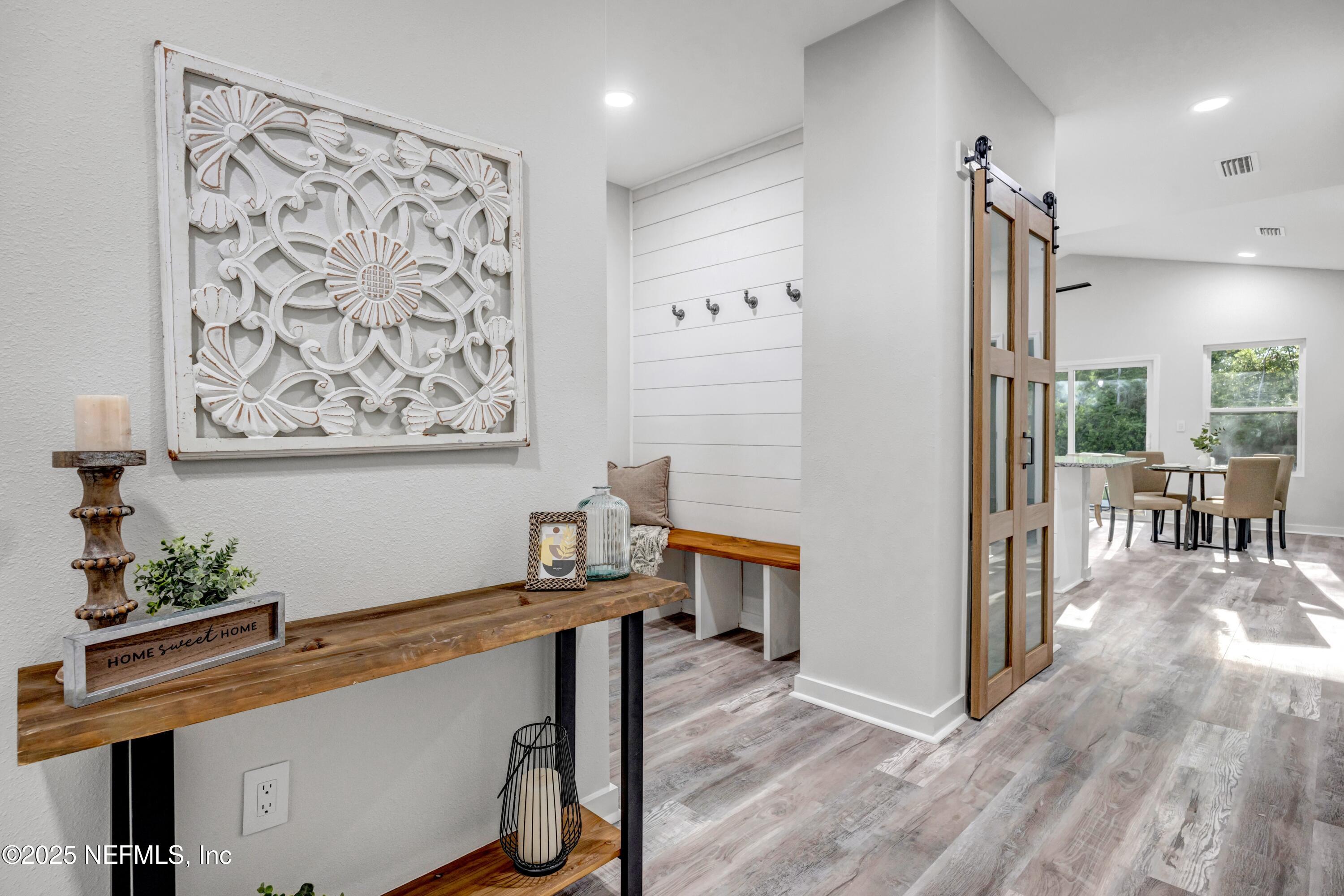 34 Delmonte Street Baldwin, FL 32234 - Photo 2 of 38 a view of a hallway with workspace and a window