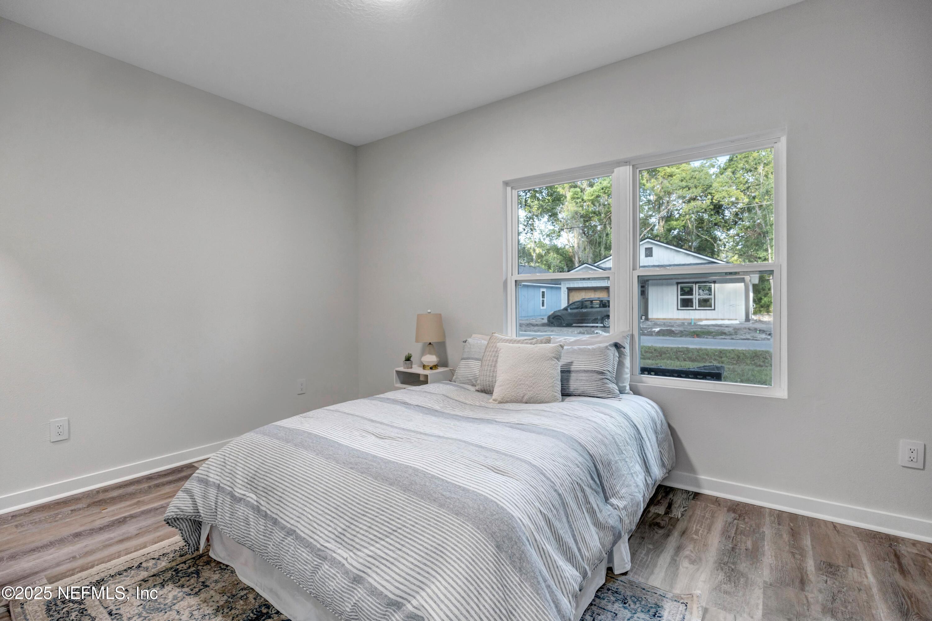 34 Delmonte Street Baldwin, FL 32234 - Photo 25 of 38 a bedroom with a bed and a window