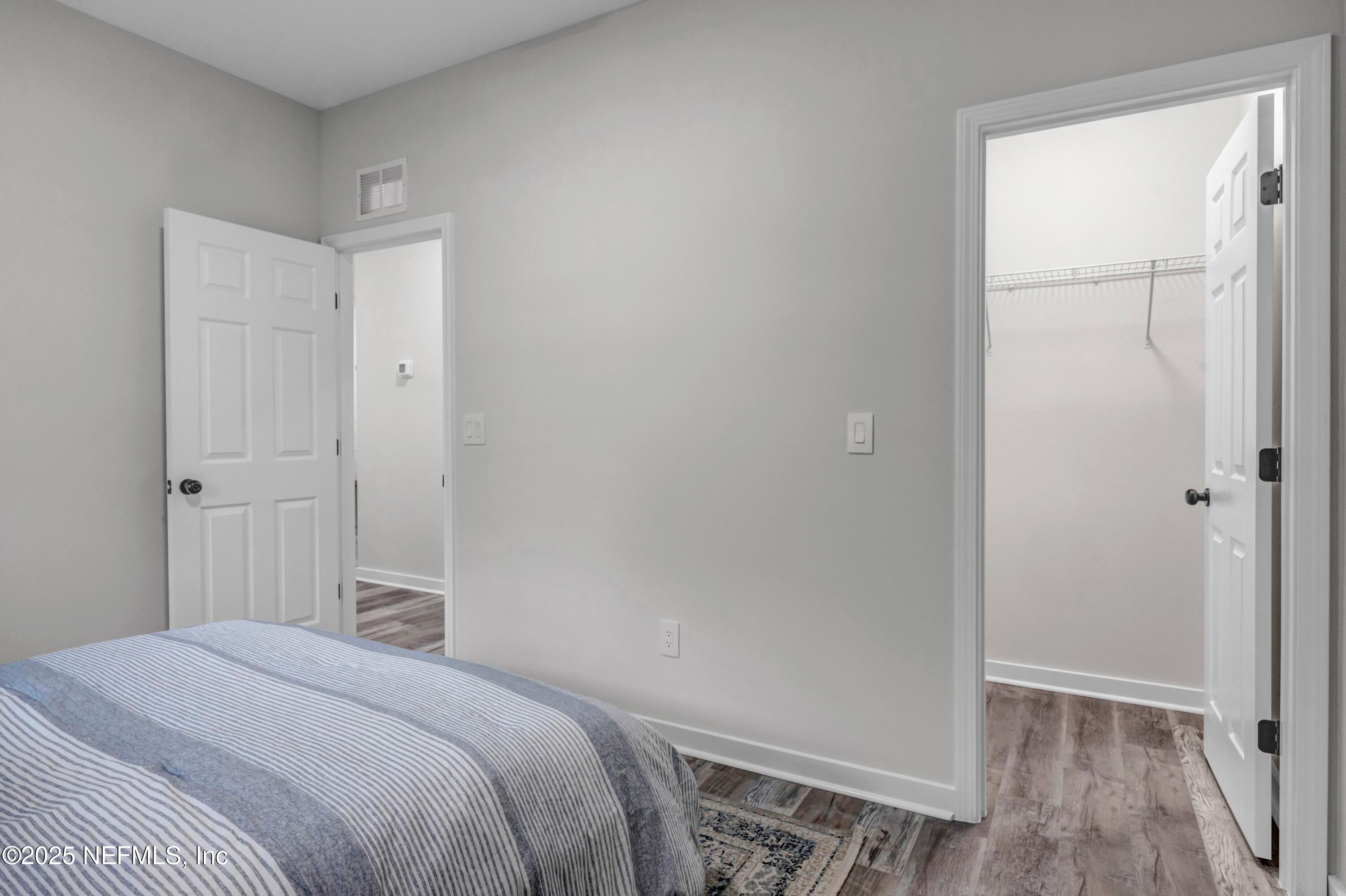 34 Delmonte Street Baldwin, FL 32234 - Photo 26 of 38 a bedroom with a bed and a window