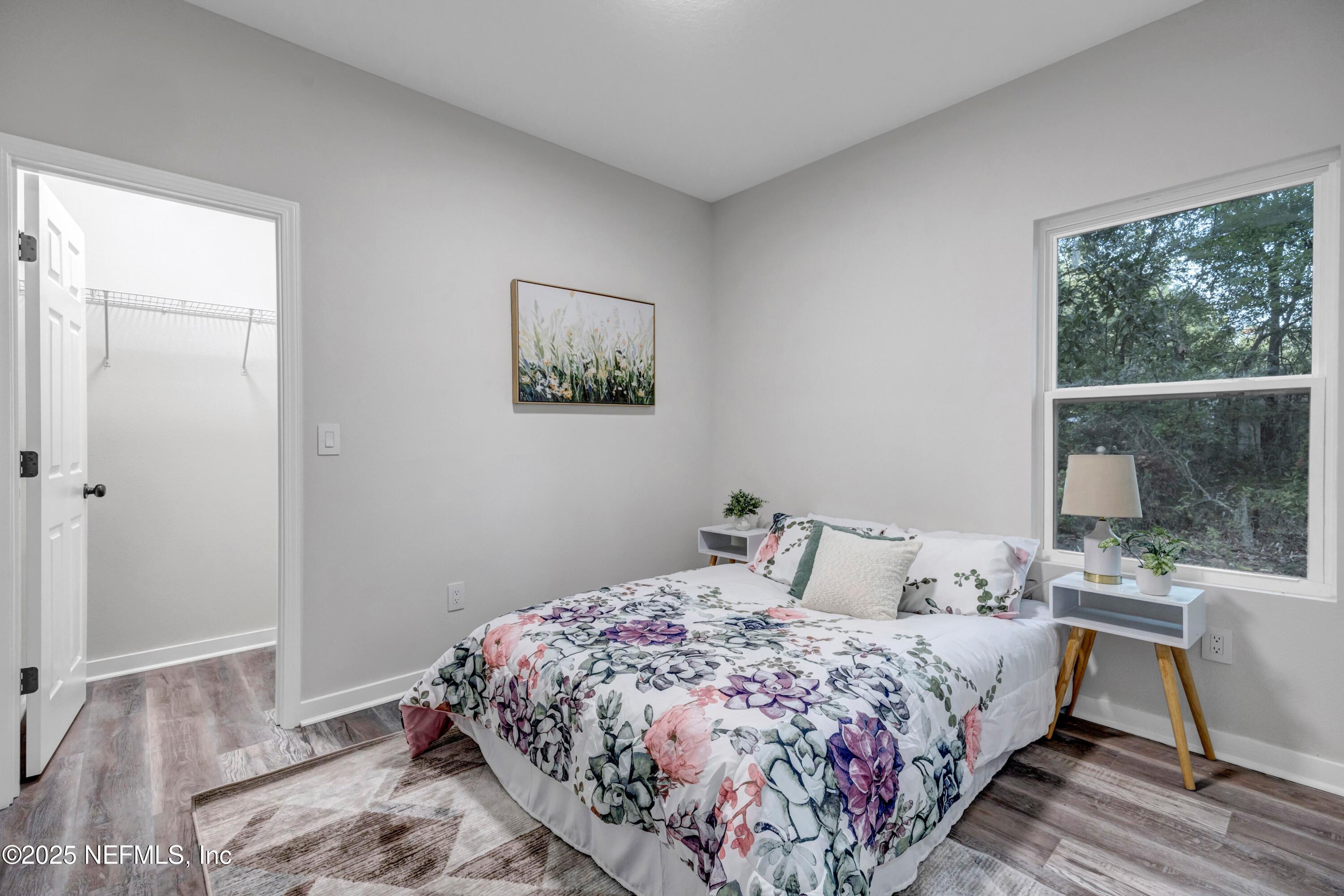 34 Delmonte Street Baldwin, FL 32234 - Photo 28 of 38 a bedroom with a bed and a large window