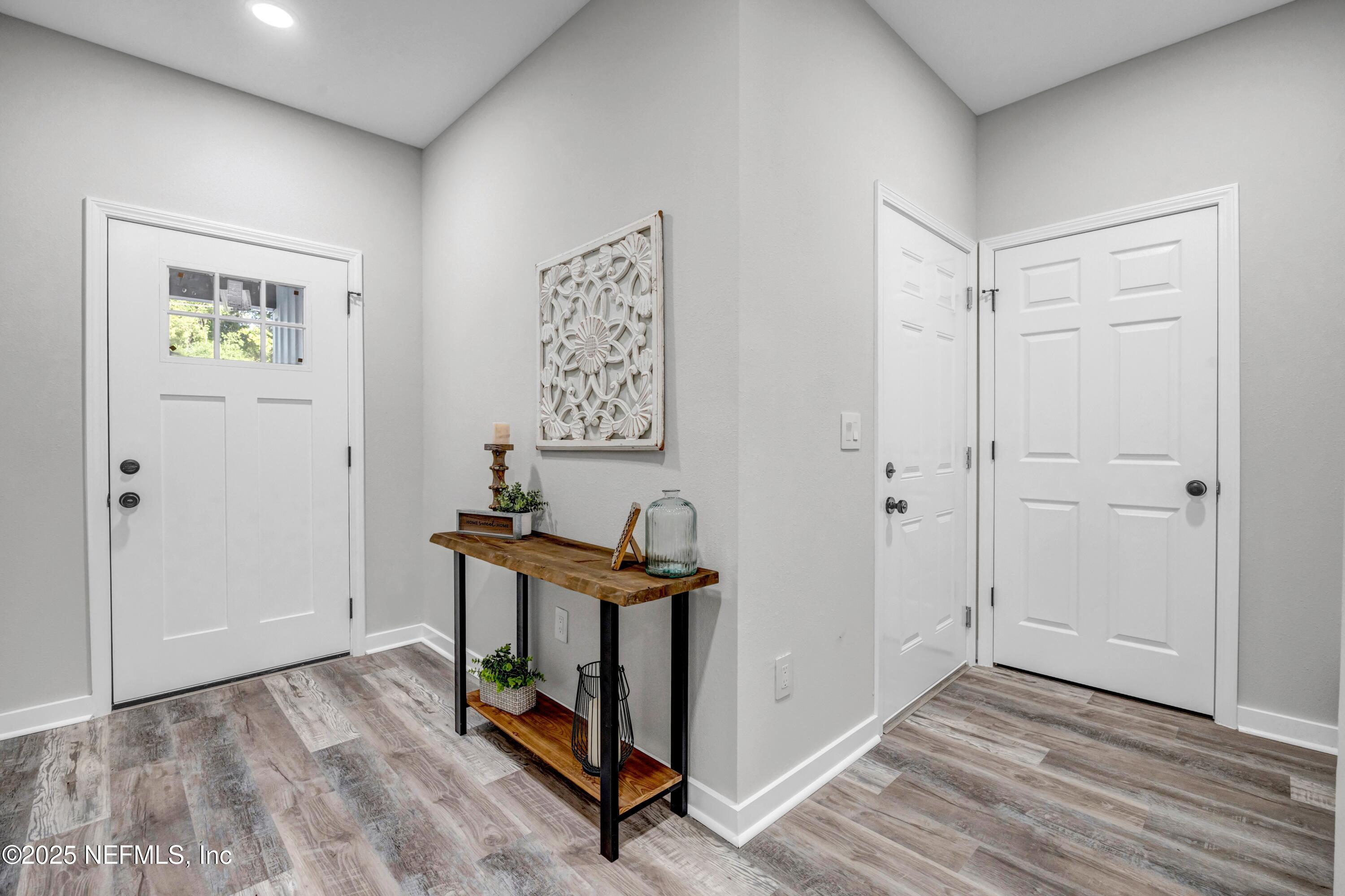 34 Delmonte Street Baldwin, FL 32234 - Photo 3 of 38 a view of a hallway with entryway door