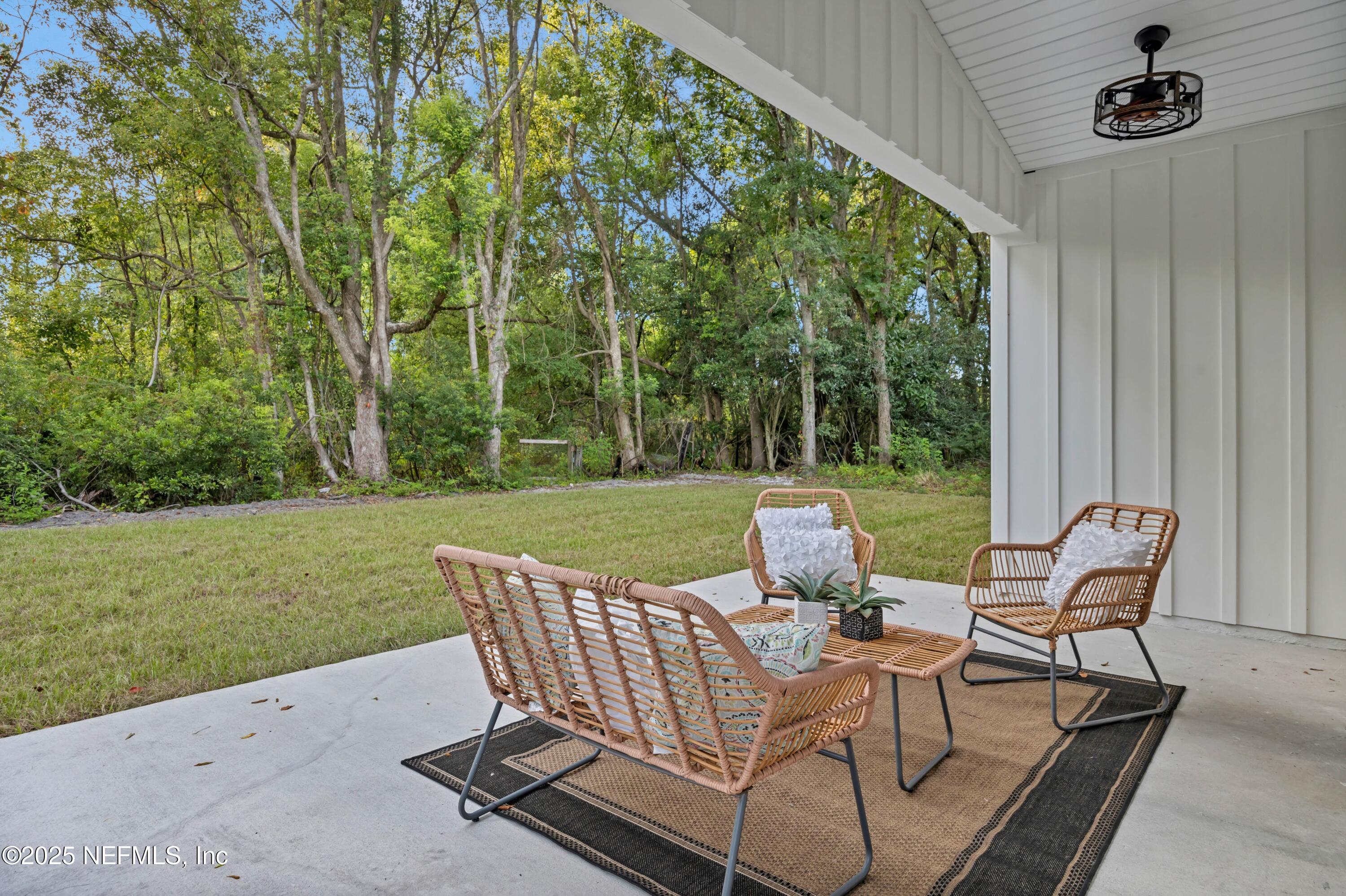 34 Delmonte Street Baldwin, FL 32234 - Photo 31 of 38 a view of a chair and table in the garden