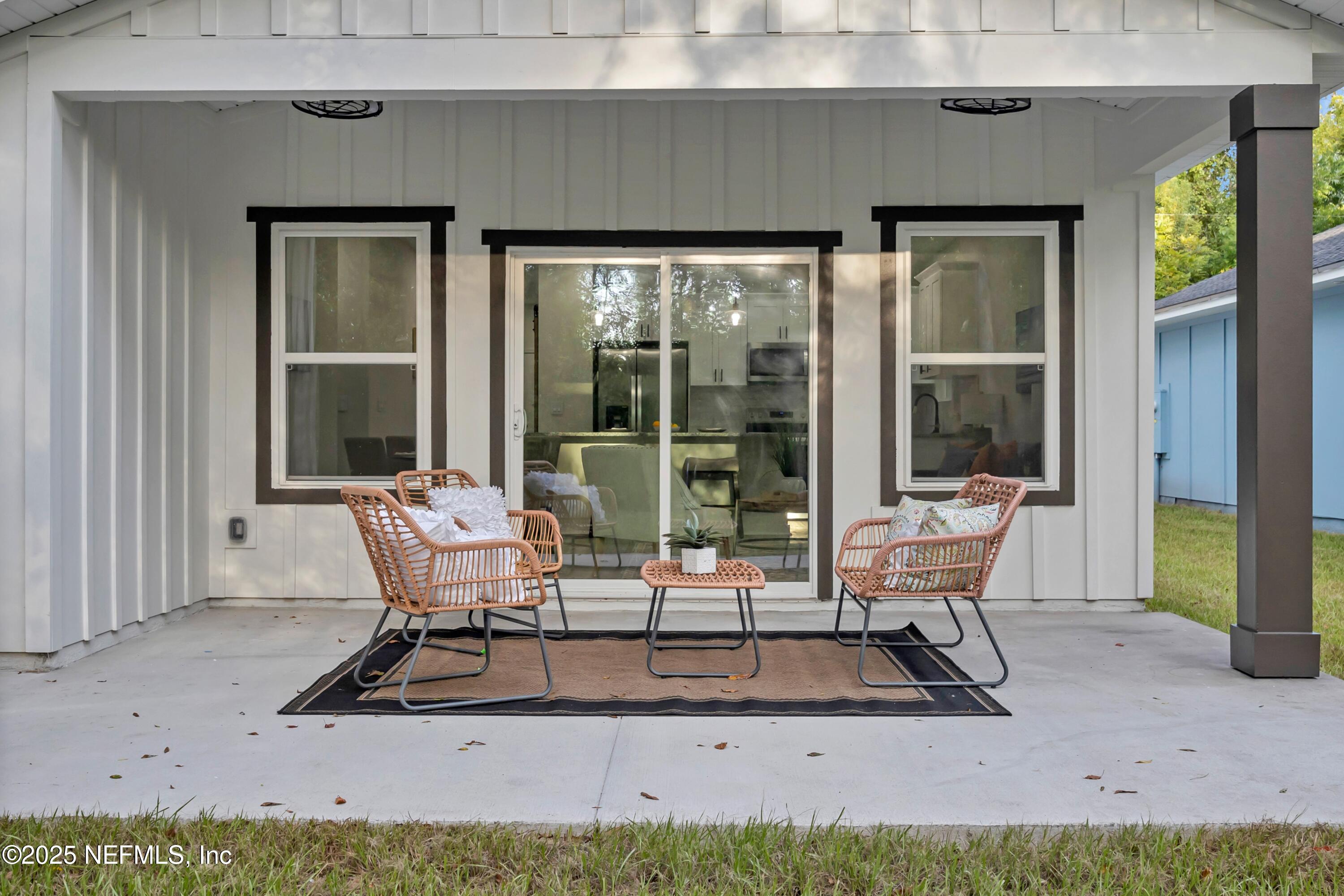 34 Delmonte Street Baldwin, FL 32234 - Photo 32 of 38 a building outdoor space with patio furniture and garden