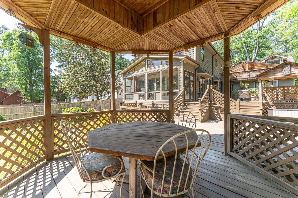 2915 Ashford Road Northeast Brookhaven, GA 30319 - Photo 13 of 60 a view of balcony with wooden floor and outdoor seating