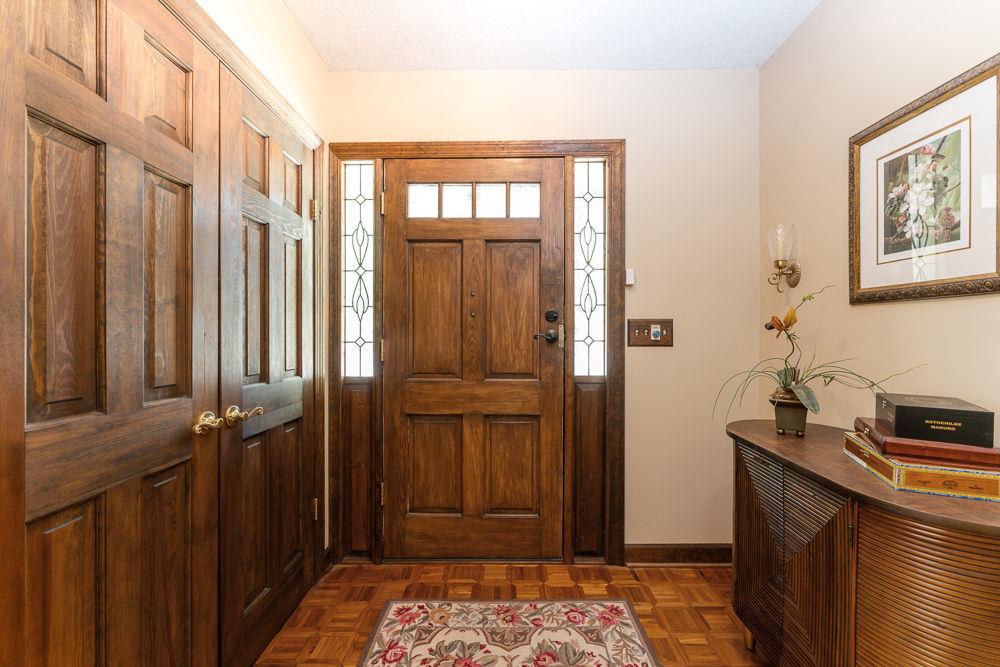 2915 Ashford Road Northeast Brookhaven, GA 30319 - Photo 19 of 60 a view of a hallway with wooden floor and a bathroom