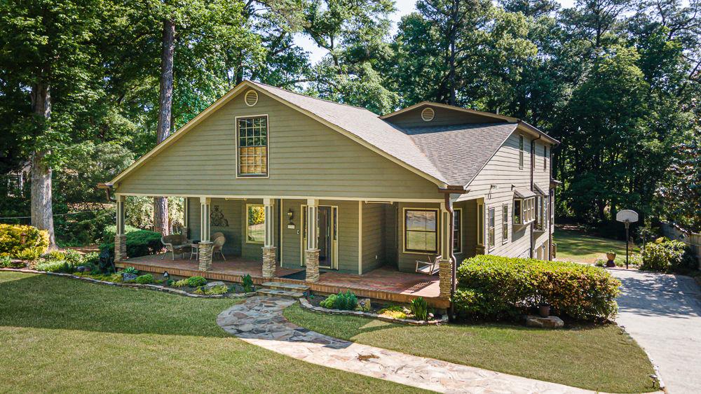 2915 Ashford Road Northeast Brookhaven, GA 30319 - Photo 2 of 60 a front view of a house with a yard
