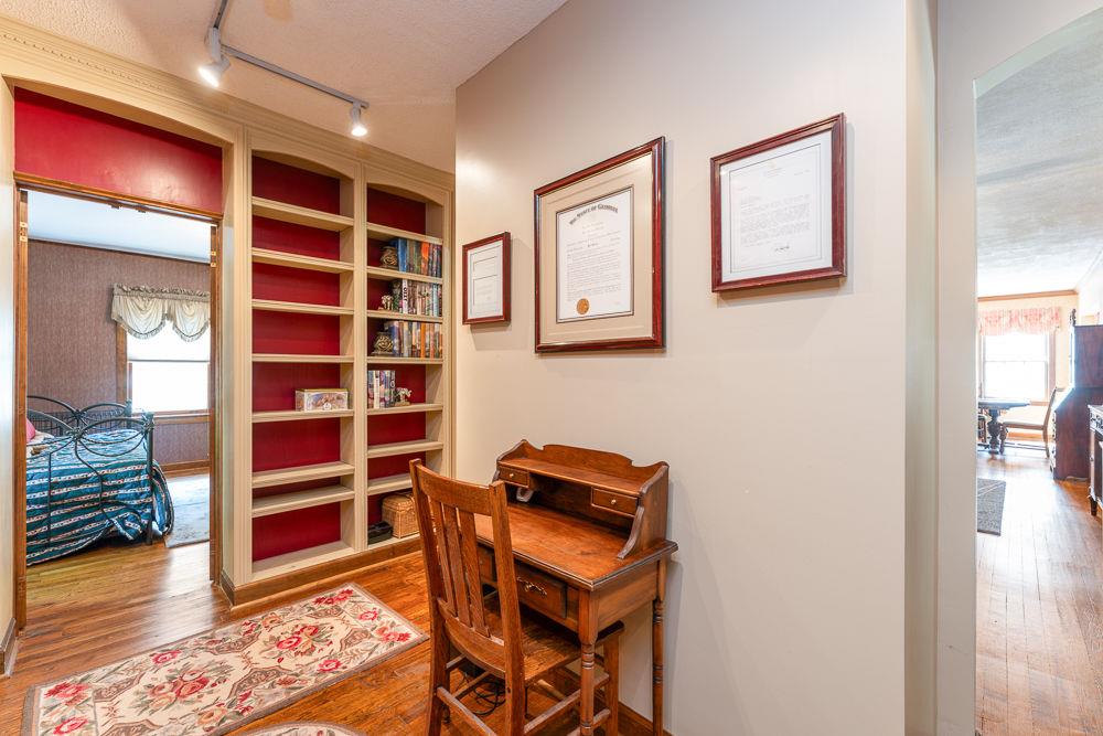 2915 Ashford Road Northeast Brookhaven, GA 30319 - Photo 23 of 60 a view of an empty room with wooden floor and closet
