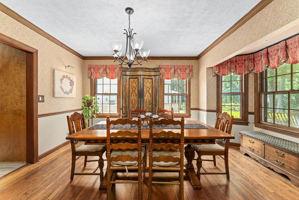 2915 Ashford Road Northeast Brookhaven, GA 30319 - Photo 24 of 60 a view of a dining room with furniture window and wooden floor
