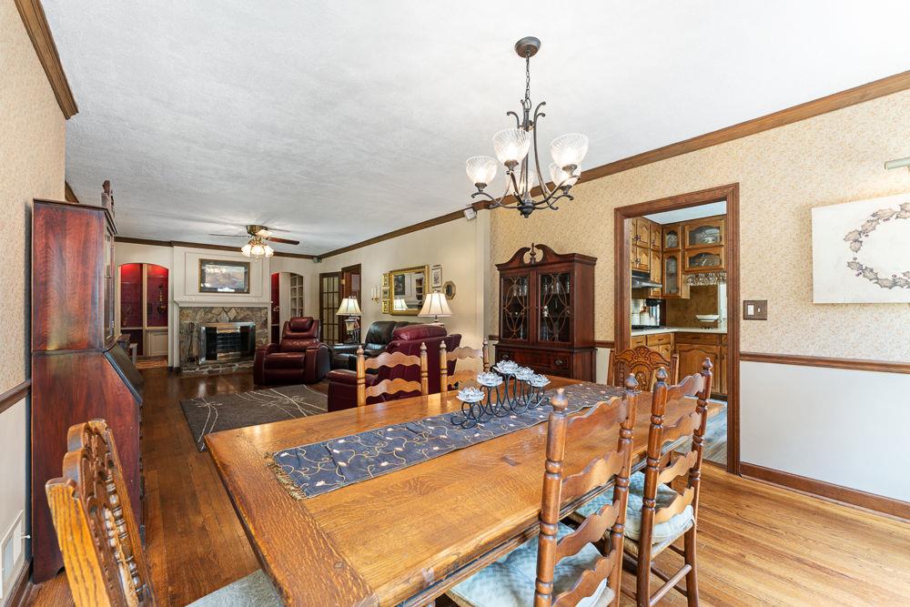 2915 Ashford Road Northeast Brookhaven, GA 30319 - Photo 26 of 60 a view of a dining room with furniture and wooden floor