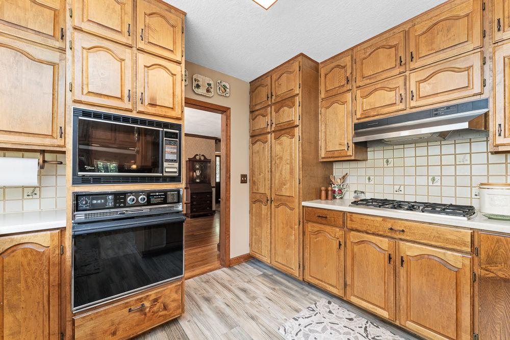 2915 Ashford Road Northeast Brookhaven, GA 30319 - Photo 27 of 60 a kitchen with stainless steel appliances granite countertop a stove and a refrigerator
