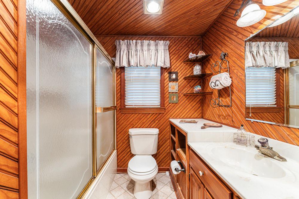 2915 Ashford Road Northeast Brookhaven, GA 30319 - Photo 31 of 60 a bathroom with a sink and toilet
