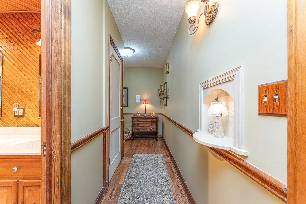 2915 Ashford Road Northeast Brookhaven, GA 30319 - Photo 34 of 60 a view of a hallway view with wooden floor and staircase