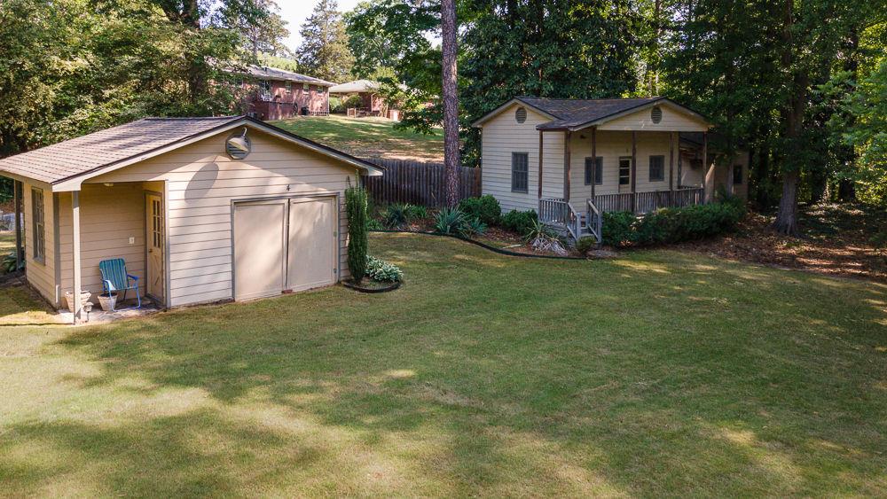 2915 Ashford Road Northeast Brookhaven, GA 30319 - Photo 4 of 60 a view of a house with a yard and large tree