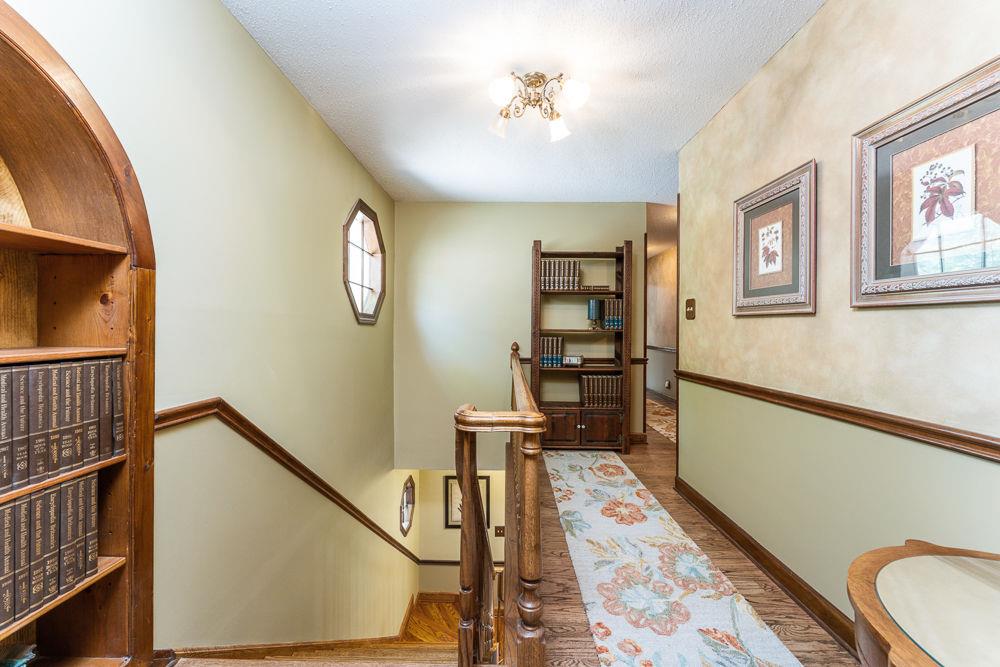 2915 Ashford Road Northeast Brookhaven, GA 30319 - Photo 45 of 60 a view of a hallway with wooden floor and staircase