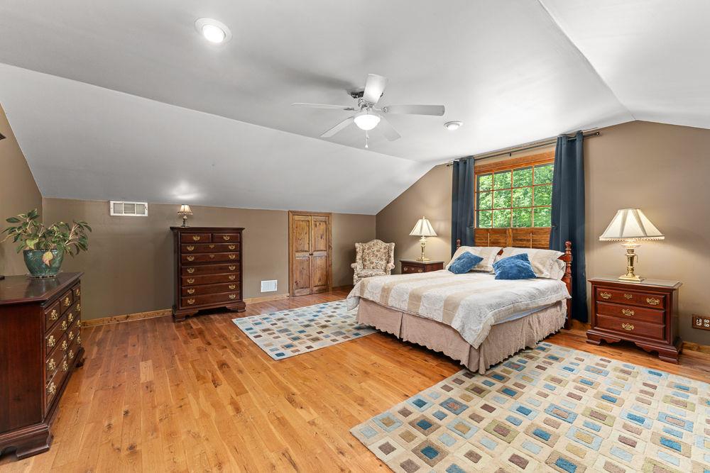 2915 Ashford Road Northeast Brookhaven, GA 30319 - Photo 49 of 60 a bedroom with double bed and a dresser
