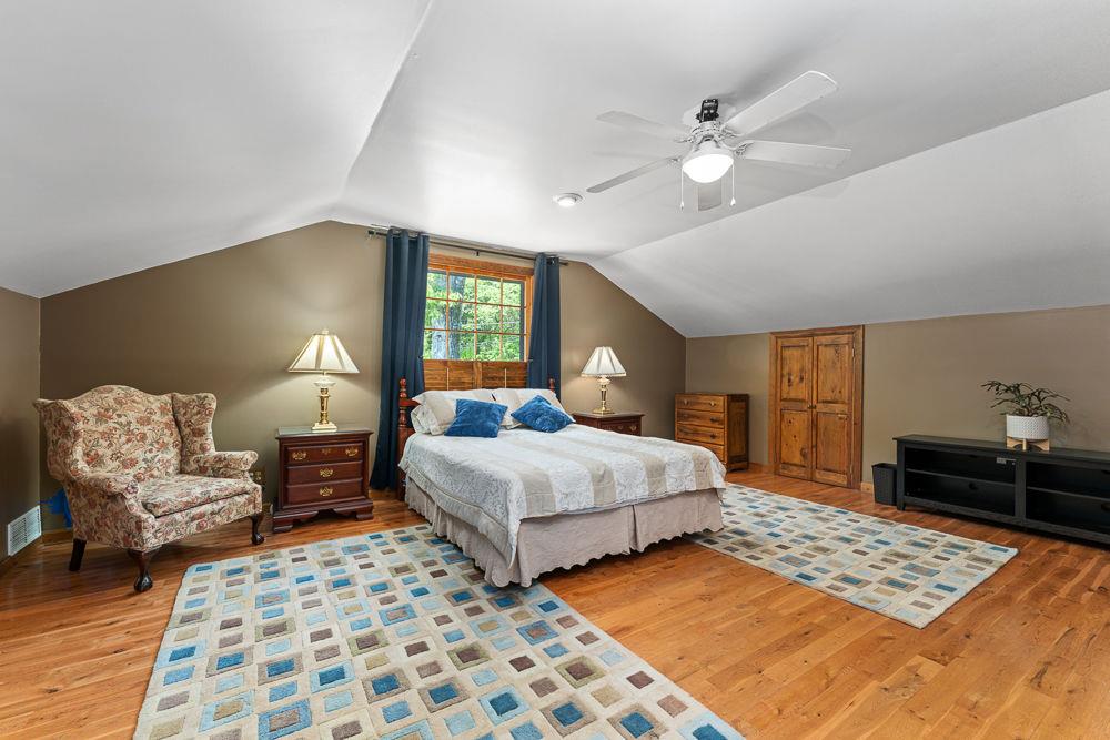 2915 Ashford Road Northeast Brookhaven, GA 30319 - Photo 50 of 60 a bedroom with a large bed and a chandelier
