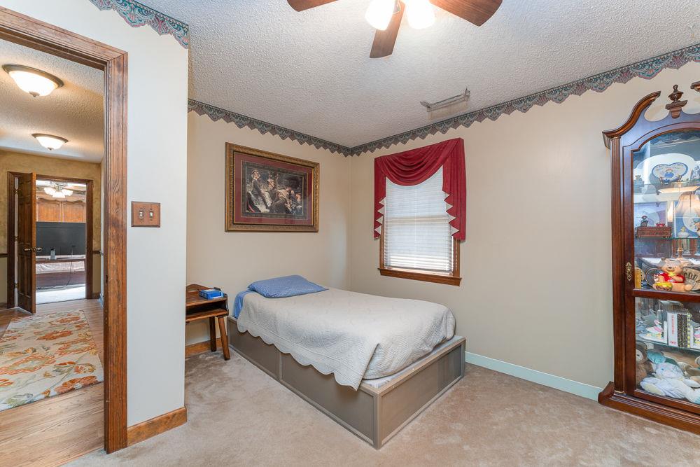 2915 Ashford Road Northeast Brookhaven, GA 30319 - Photo 52 of 60 a bedroom with a bed and a painting on the wall