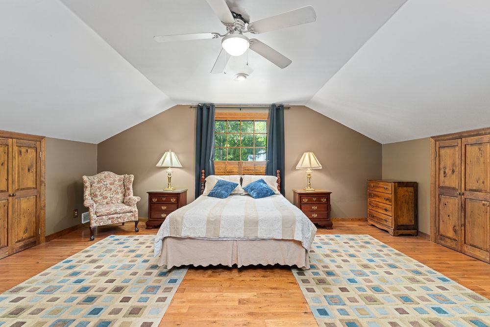2915 Ashford Road Northeast Brookhaven, GA 30319 - Photo 56 of 60 a bedroom with a large bed and a chandelier