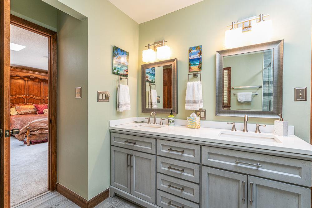 2915 Ashford Road Northeast Brookhaven, GA 30319 - Photo 57 of 60 a bathroom with a double vanity sink and a mirror