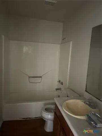 a bathroom with a sink and toilet