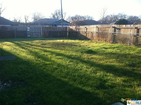 a swimming pool with wooden fence