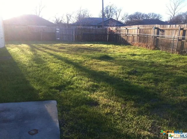 a view of a backyard with a garden