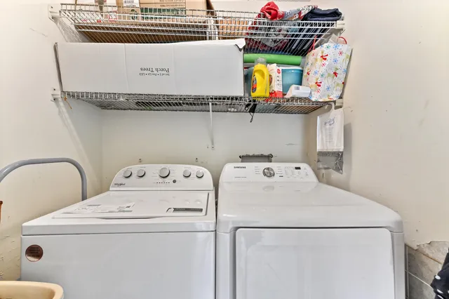 a utility room with dryer and washer
