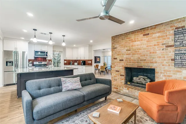 a living room with furniture and a fireplace