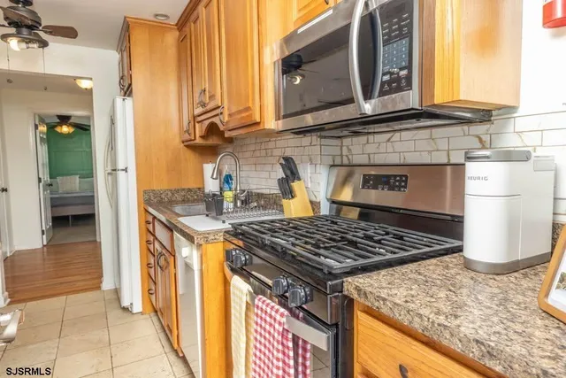 a kitchen with a stove and a cabinet