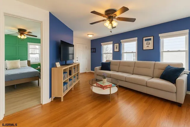 a living room with furniture and a flat screen tv