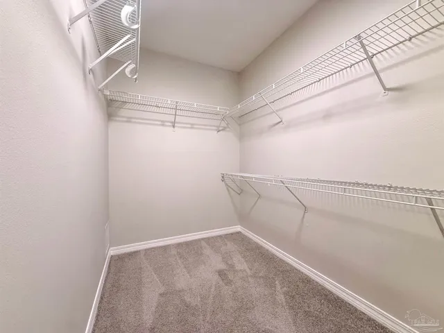 a view of a room with racks on the wall