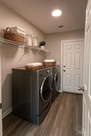 a utility room with dryer and washer