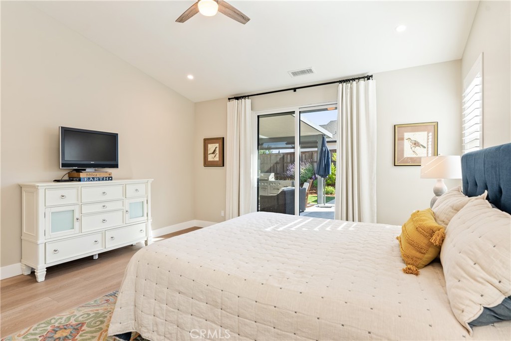 8550 El Corte Road Atascadero, CA 93422 - Photo 24 of 72 a bedroom with a large bed and a flat screen tv