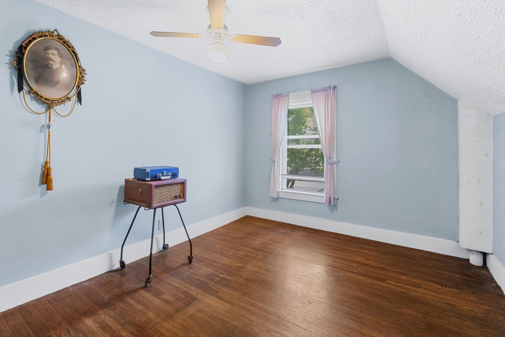20 Trinity Avenue Lynn, MA 01902 - Photo 18 of 29 a view of a room with wooden floor fan and windows