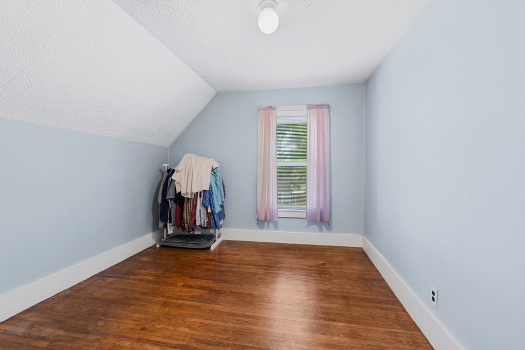20 Trinity Avenue Lynn, MA 01902 - Photo 20 of 29 a view of a room with wooden floor and windows