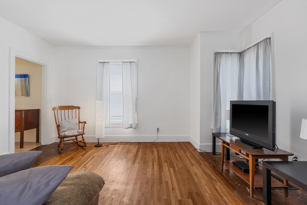 20 Trinity Avenue Lynn, MA 01902 - Photo 2 of 29 a living room with furniture and a flat screen tv