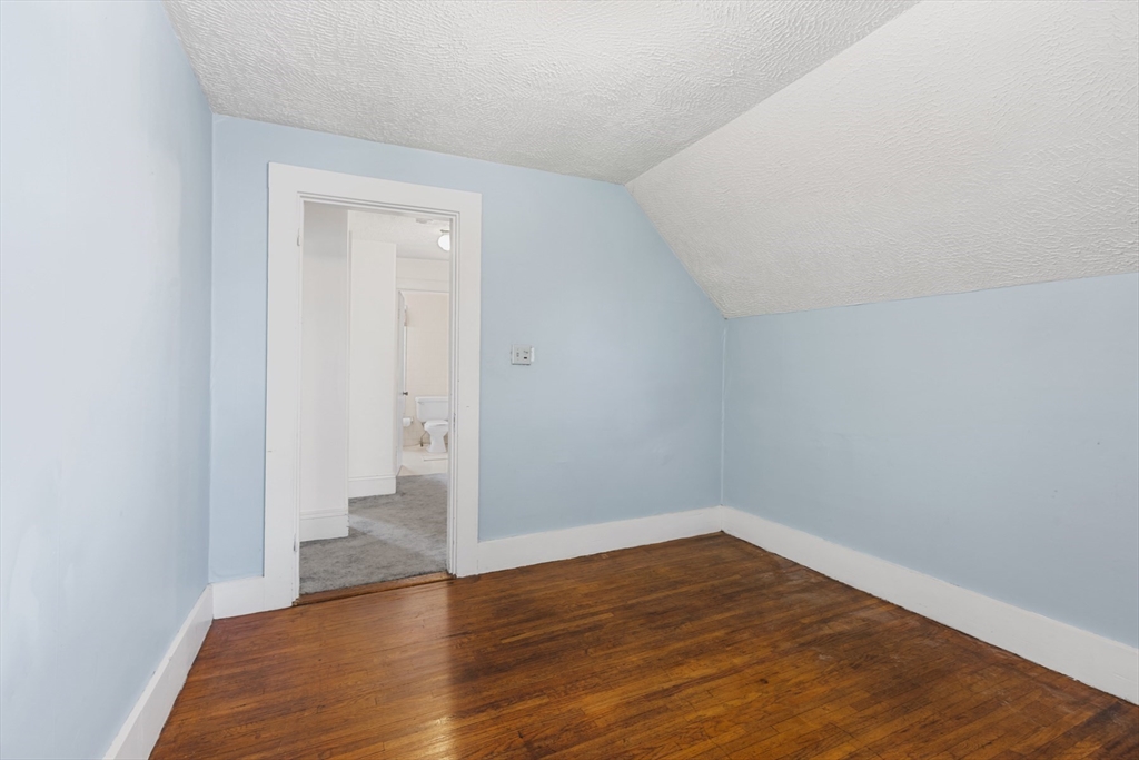 20 Trinity Avenue Lynn, MA 01902 - Photo 21 of 29 a view of an empty room and wooden floor