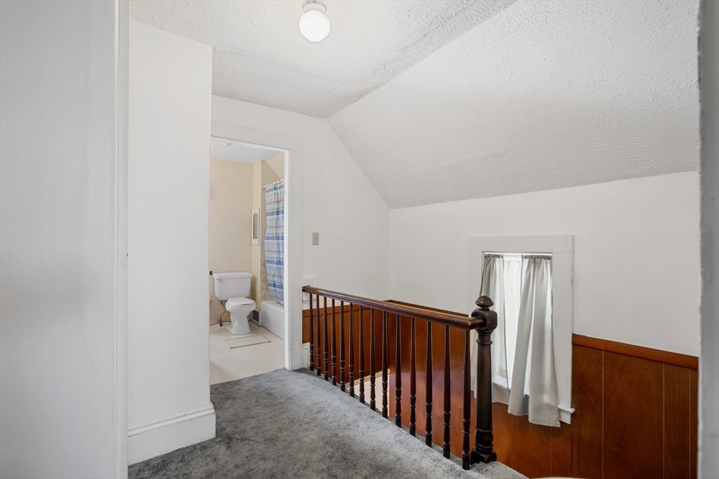 20 Trinity Avenue Lynn, MA 01902 - Photo 22 of 29 a view of a hallway with closet and stairs