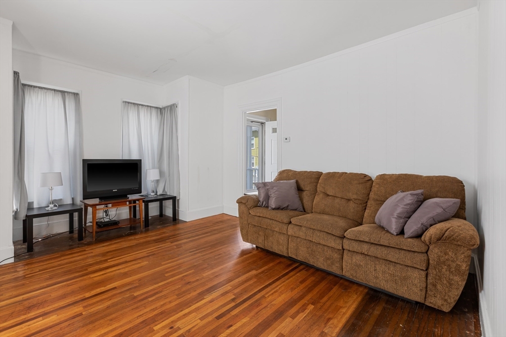 20 Trinity Avenue Lynn, MA 01902 - Photo 4 of 29 a living room with furniture and a flat screen tv