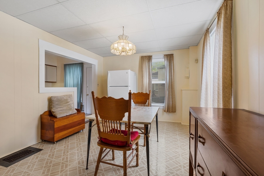 20 Trinity Avenue Lynn, MA 01902 - Photo 5 of 29 a view of a dining room with furniture and wooden floor