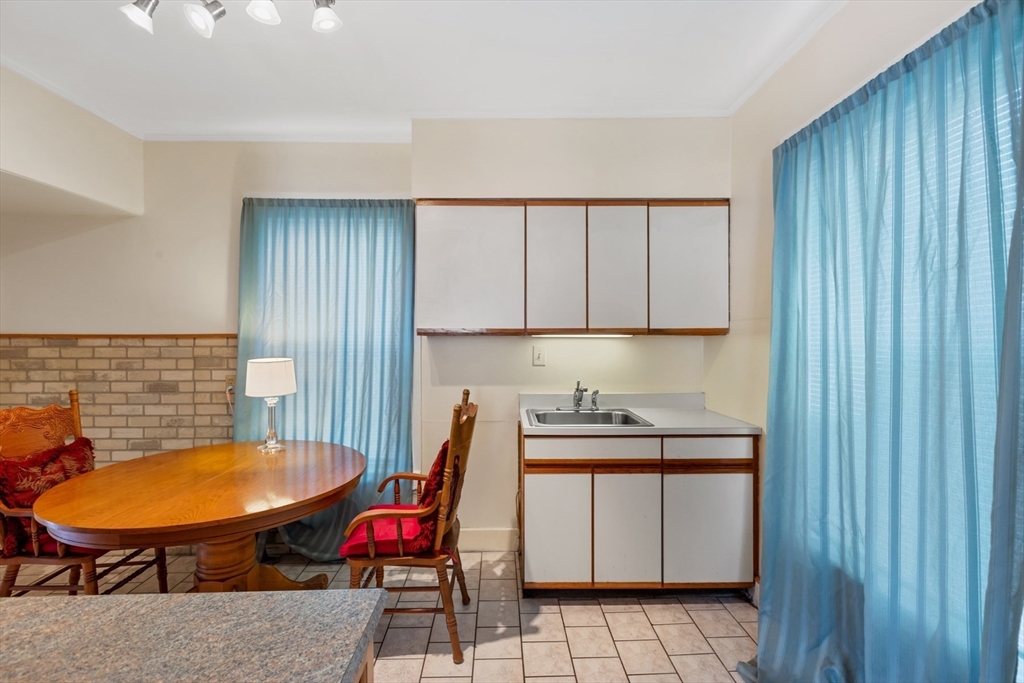 20 Trinity Avenue Lynn, MA 01902 - Photo 8 of 29 a view of a room with gym equipment