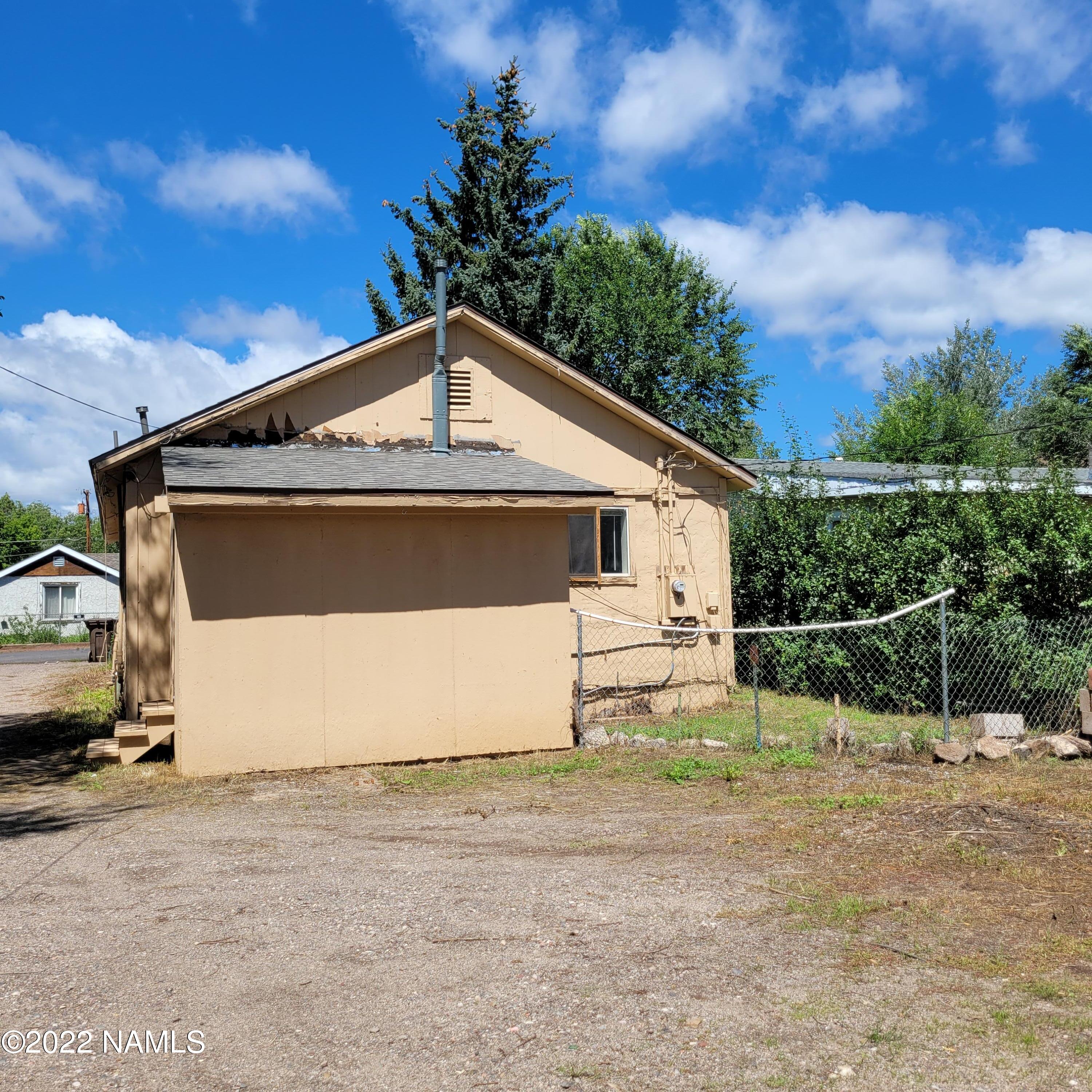 418 South WC Riles Drive Flagstaff, AZ 86001 - Photo 11 of 11 a front view of a house with a space